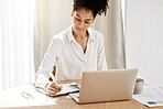 Fintech, budget and woman writing at laptop with notebook at table with finance or tax documents. Savings, strategy and planning, black woman working on payment plan for online financial investment.