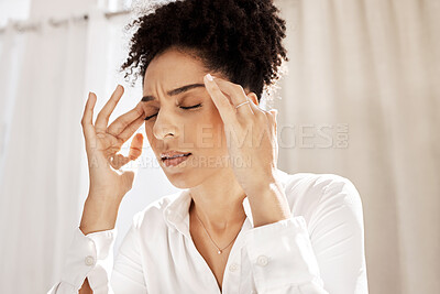 Headache, stress and black woman in home with pain feeling exhausted, burnout and anxiety. Depression, mental health problems and stressed female holding head from discomfort, migraine and frustrated