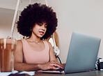 Black woman afro, laptop and designer working, studying or typing email in remote work at home. Stylish African American female freelancer busy on computer in design course or business research