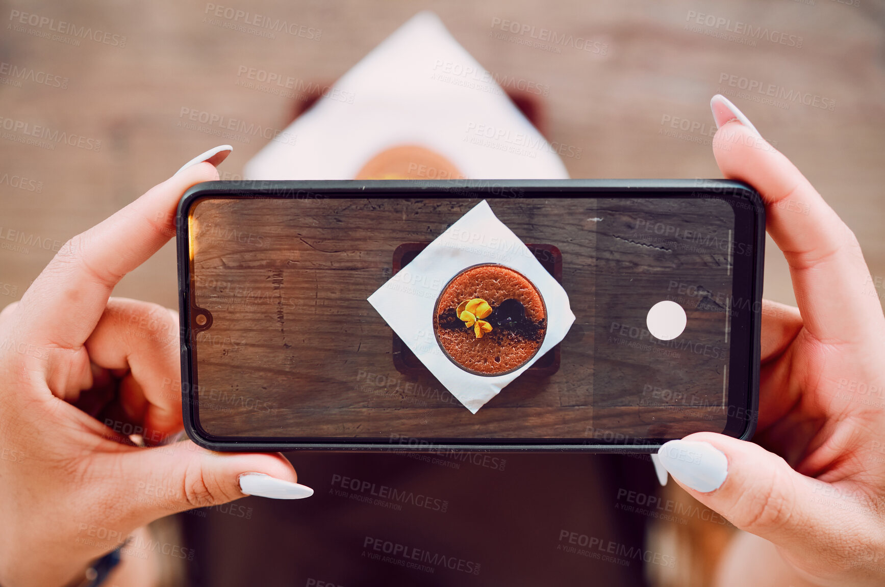 Buy stock photo Smartphone photography, hands and coffee shop, cafe or restaurant for drink review on social media content marketing. Blog, ux and content creator holding phone screen of chocolate dessert from above