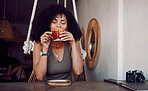 Black woman, coffee or tea to relax at a cafe for thinking, motivation and morning inspiration at a table of restaurant. Female customer smelling aroma of brazil roast or caffeine at coffee shop
