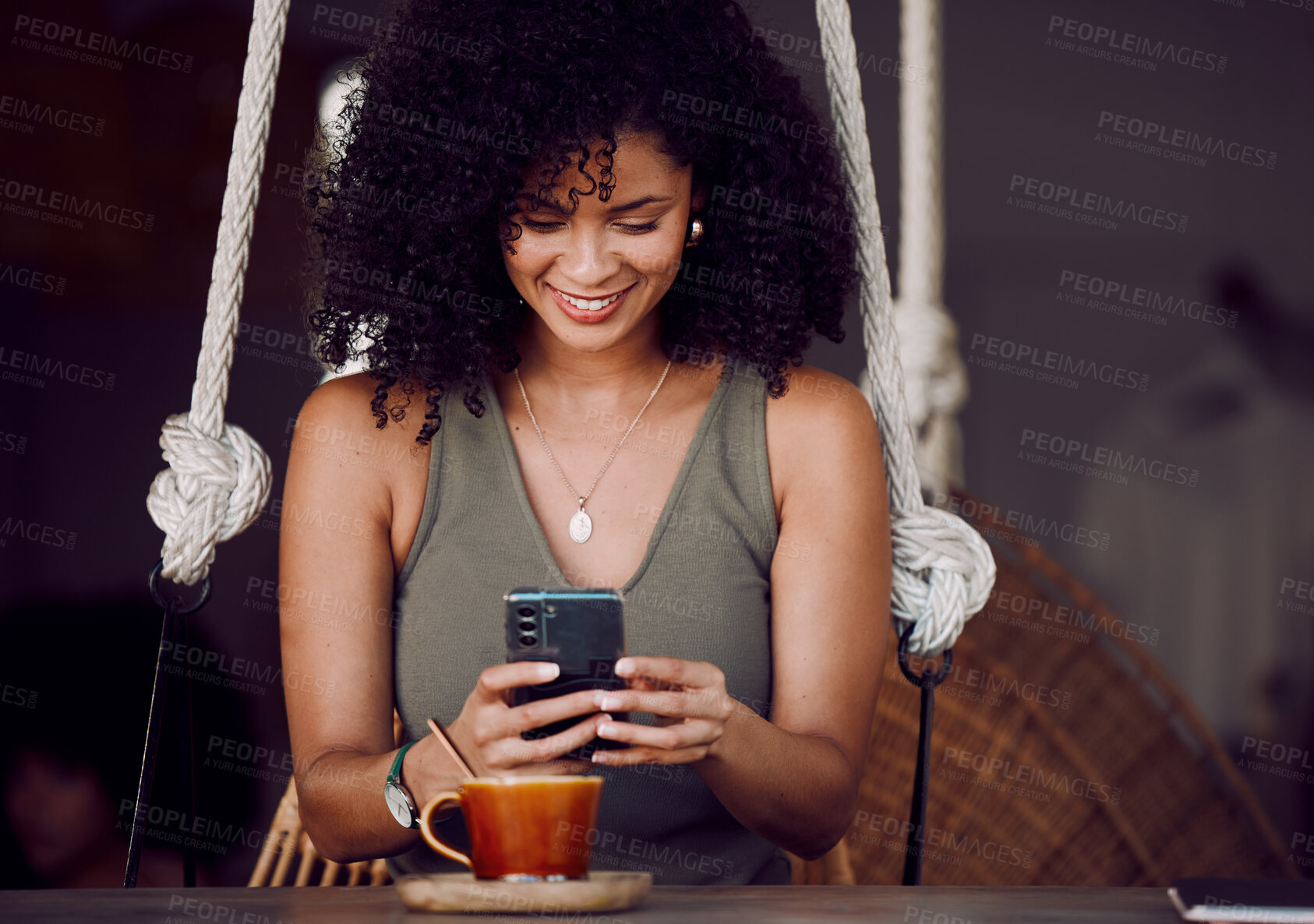 Buy stock photo Coffee shop, online and black woman with coffee and phone in hand enjoy freedom, weekend and vacation. Happiness, relax and girl using smartphone for social media, typing message and internet in cafe