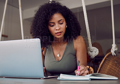 Buy stock photo Black woman, laptop and writing in notebook for planning schedule, calendar or dairy for task reminder at home. African American female designer or event planner taking notes for project plan or idea