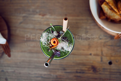 Buy stock photo Top view, fruit smoothie or green juice as healthy breakfast diet, weight loss or protein milkshake in home kitchen, house or restaurant. Morning wellness cup, detox drink or vegetable leaf cocktail