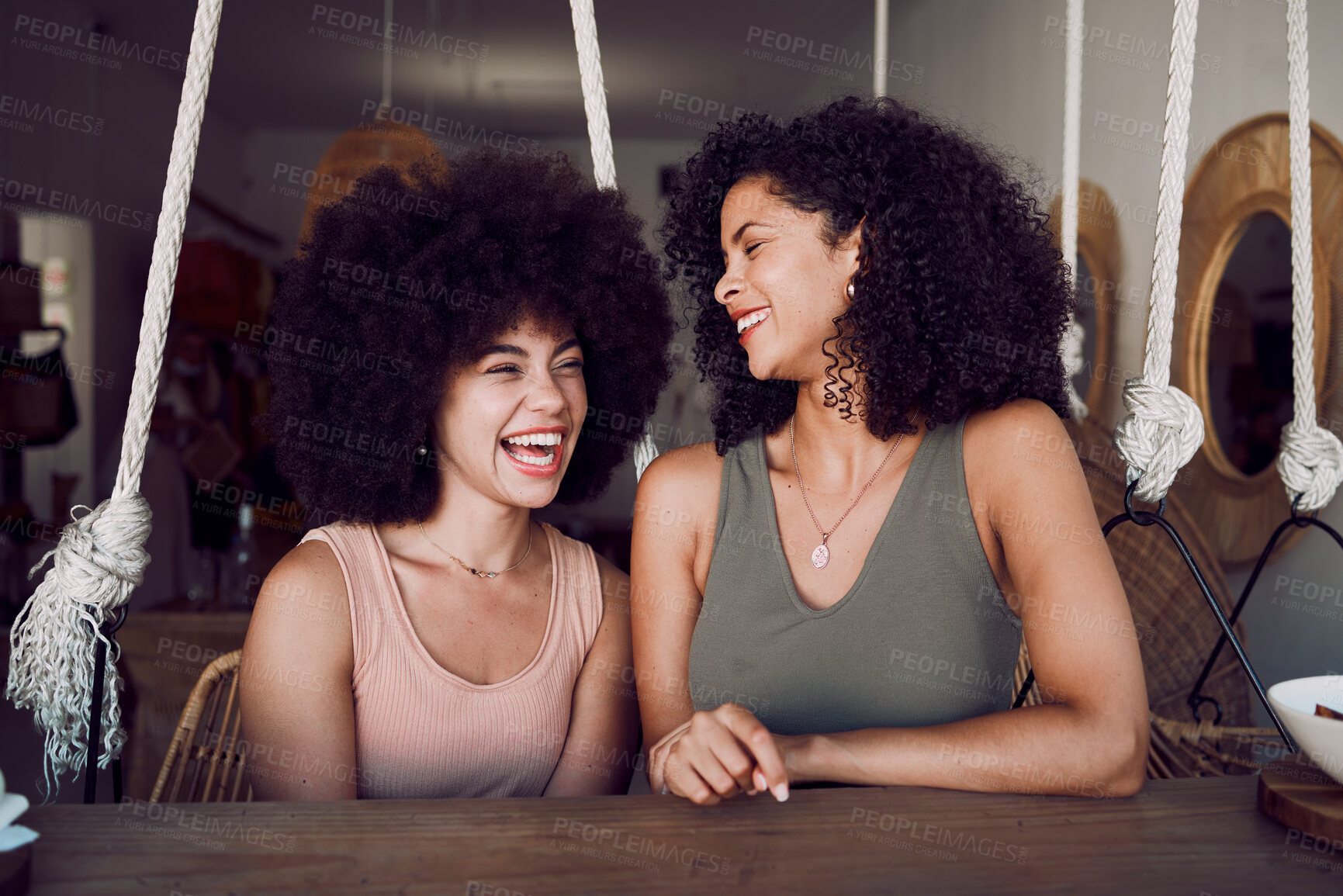 Buy stock photo Cafe, communication and black woman friends in funny conversation, talking and happy together for social youth life. Coffee shop. Eco friendly chair and small business restaurant with people bonding