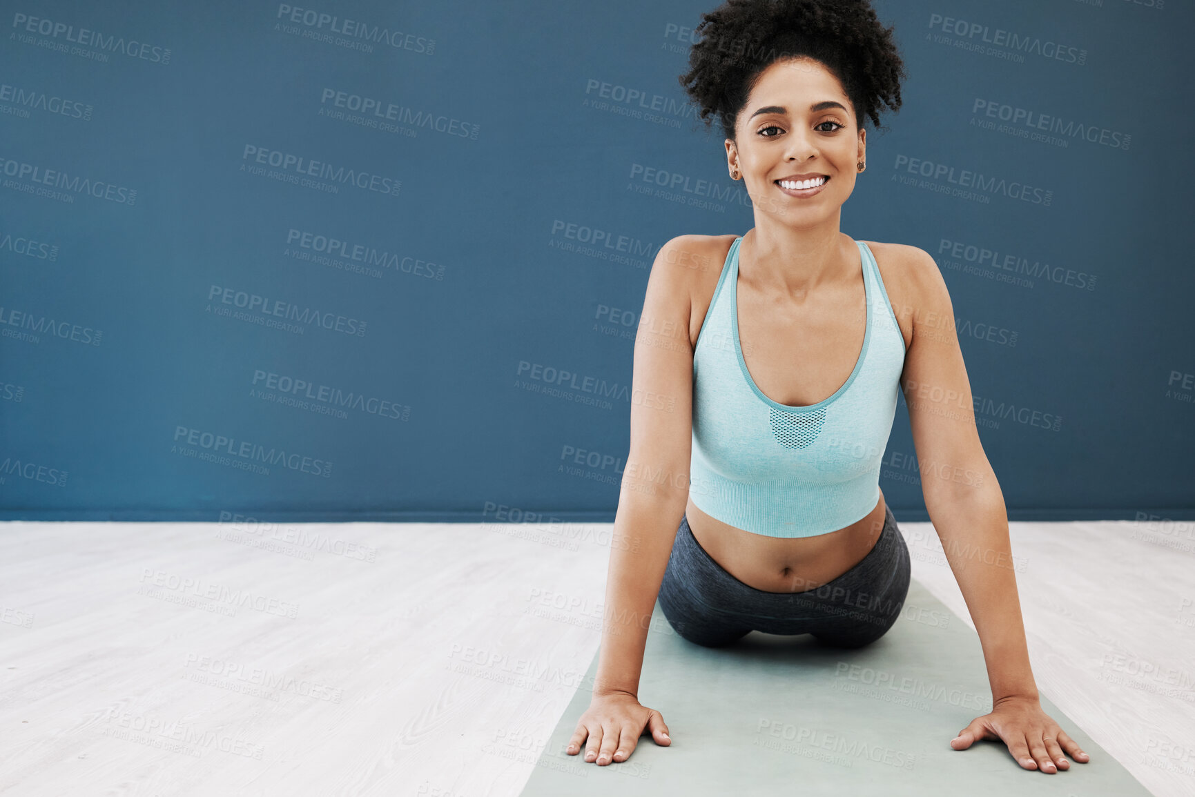 Buy stock photo Exercise, yoga and cobra pose with black woman for workout, exercise and wellness studio mockup with a smile, happiness and health. Portrait of female happy about fitness, body and mental health