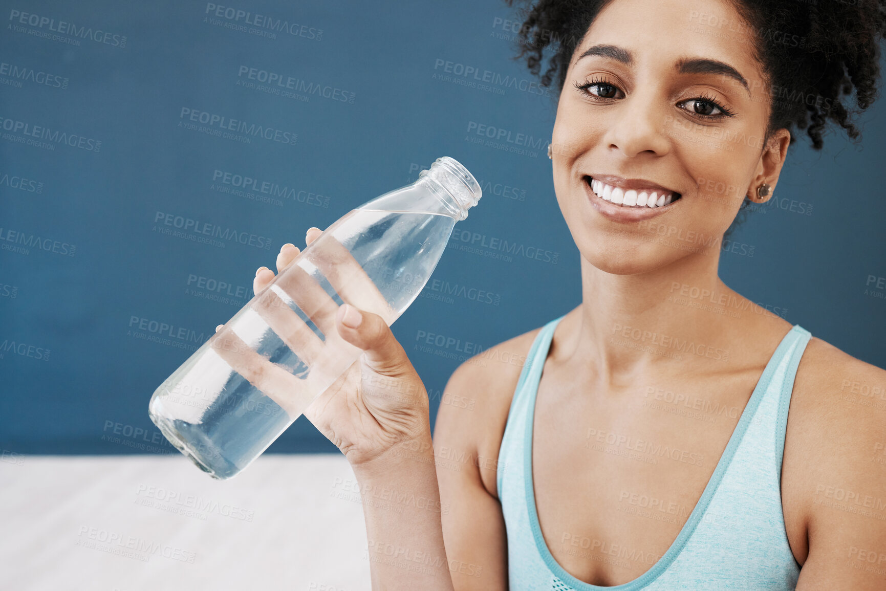 Buy stock photo Drinking water, fitness and black woman in workout studio with blue wall mockup for healthy lifestyle, wellness and nutrition. Portrait of sports, athlete or yoga woman with water bottle for exercise