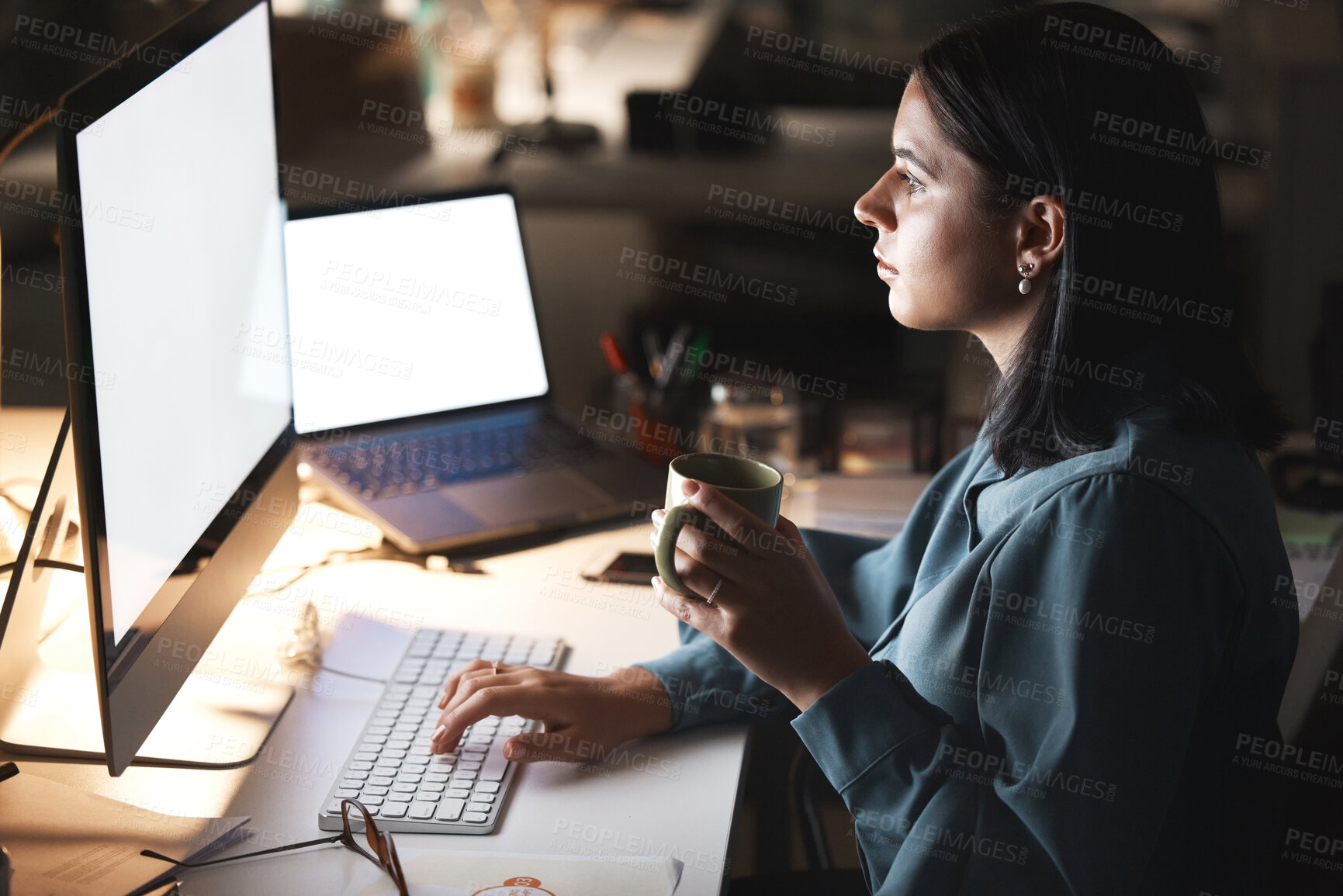 Buy stock photo Computer, laptop and woman at night working with mockup screen at it company office. Coffee, late and programmer employee working on project deadline in professional workspace with focus.