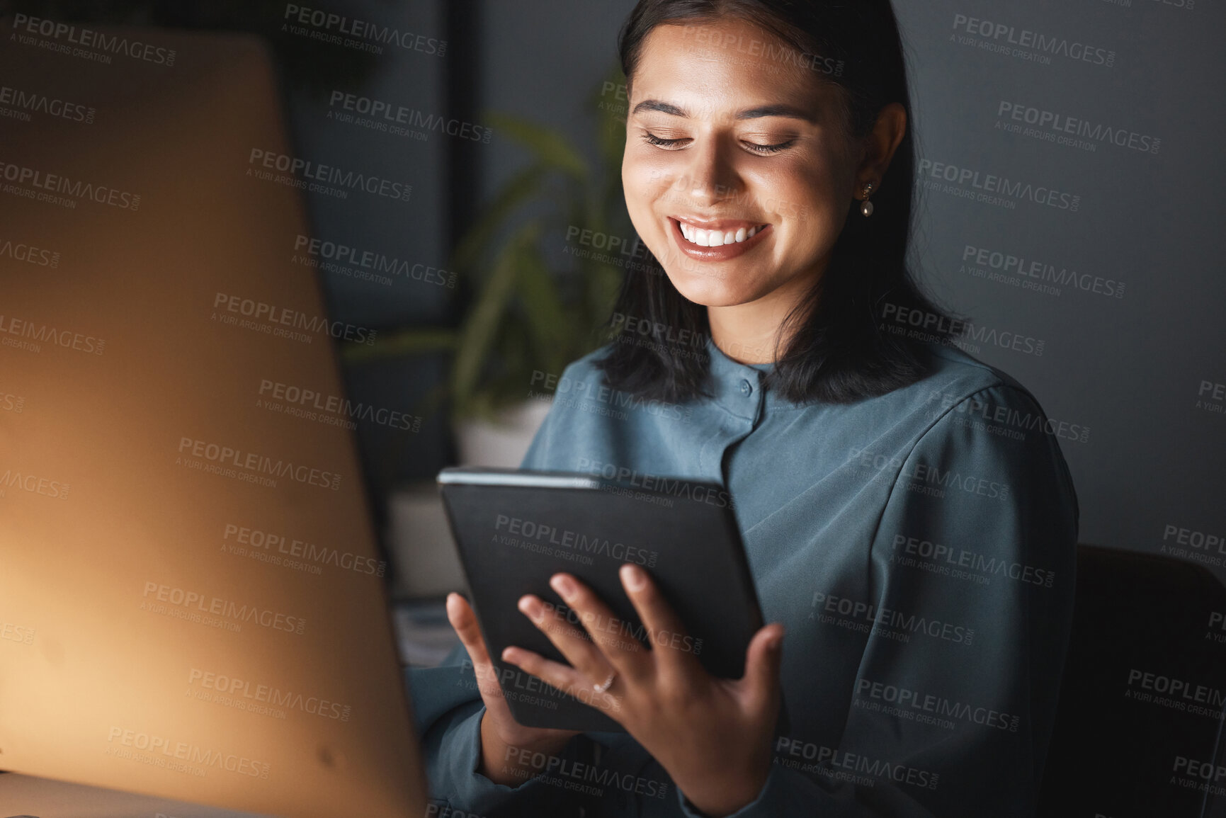 Buy stock photo Woman, tablet and happy on internet at night in office, working on digital marketing with mobile tech. Businesswoman smile, work and browser social media, web ux or online communication on app