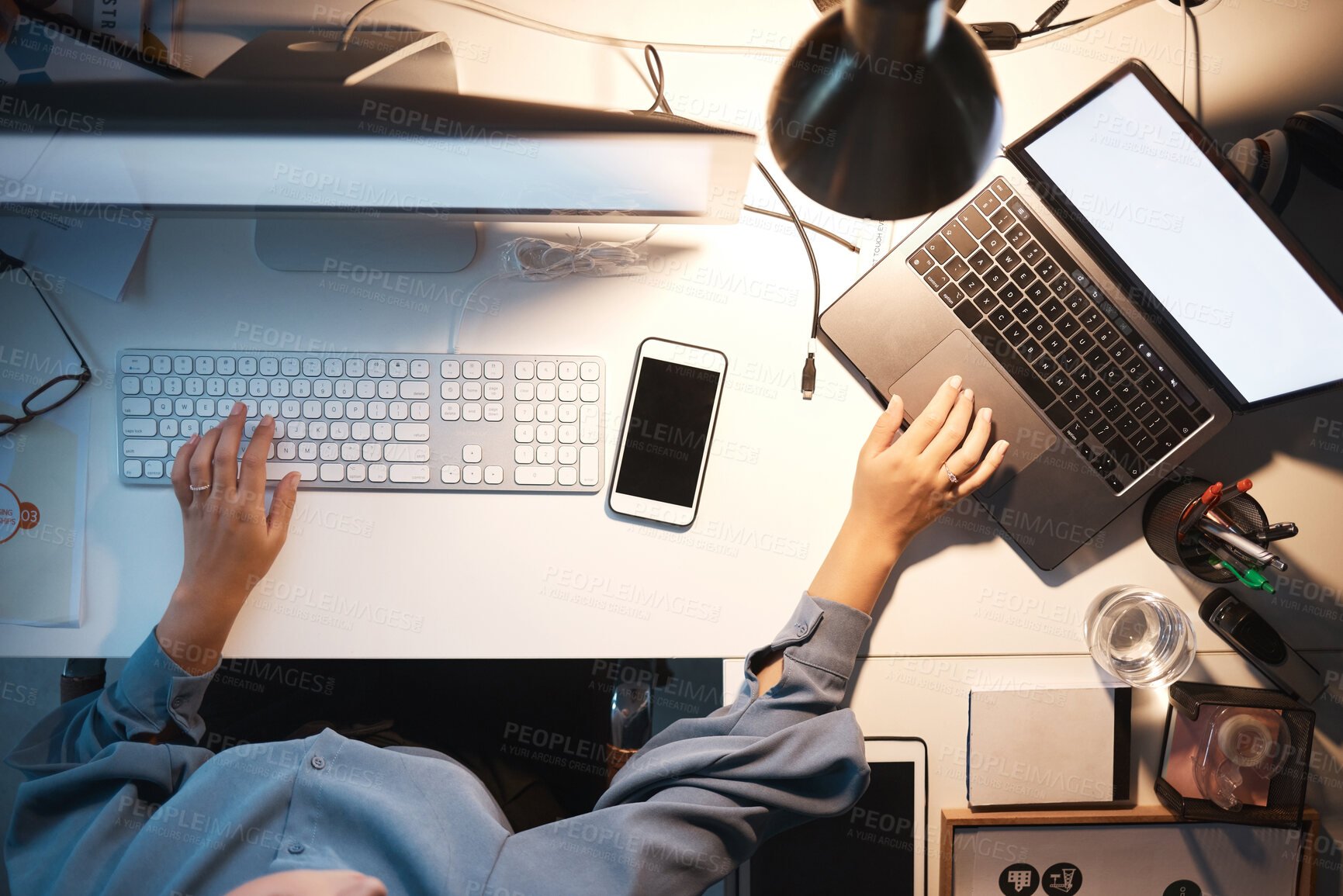 Buy stock photo Business woman, computer and hands typing on keyboard above at night with laptop, PC and phone on office desk for software, coding and engineering. IT technician working on research and programming