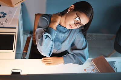 Buy stock photo Woman, neck pain and night in office, working overtime and massage muscle, joint or body ache at desk. Businesswoman, burnout and tired with work injury while sitting at workplace table with stress