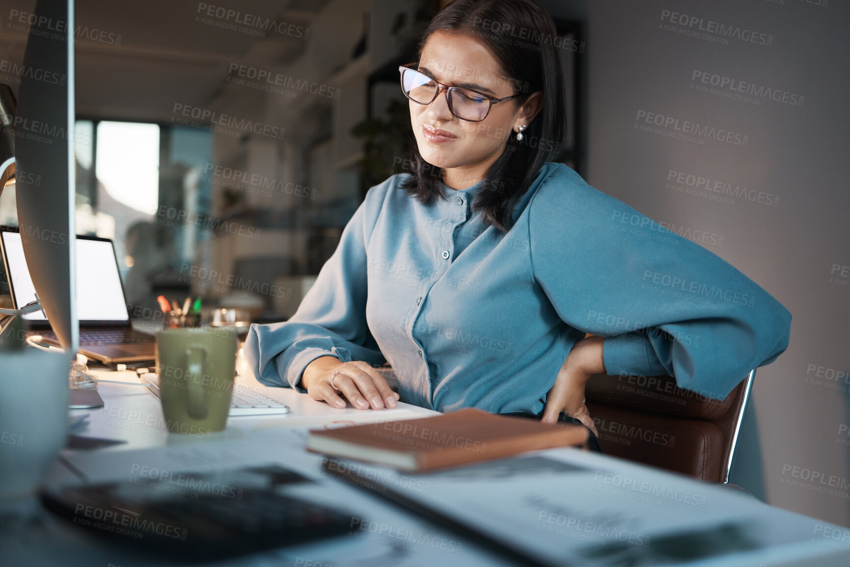 Buy stock photo Corporate, computer or business woman with back pain in office while working on laptop, research or planning. Worker, employee or manager suffering with accident at desk with anatomy or spine problem