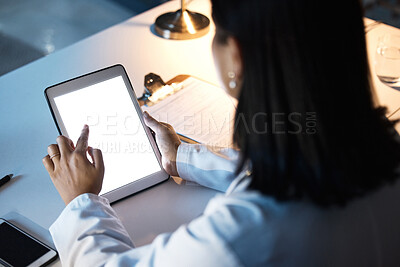 Buy stock photo Night business, woman and tablet, screen and website research, iot innovation and data planning at office desk. Female worker using digital app in dark company, technology software and brand strategy