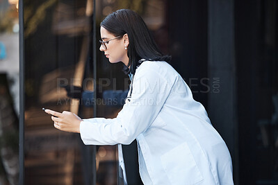 Buy stock photo Woman, doctor and phone on hospital break, clinic balcony or consulting on social media, internet research or schedule planning. Thinking healthcare worker, mobile technology and 5g calendar app