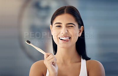 Buy stock photo Cleaning, wooden toothbrush and woman in bathroom with cute expression on face ready for brushing teeth. Dentistry, oral healthcare and girl with natural, organic and eco friendly dental care product