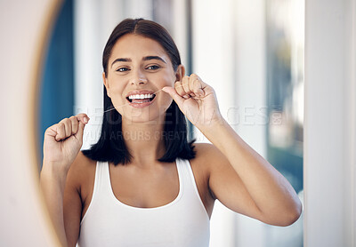 Buy stock photo Dental floss, teeth and woman in mirror of bathroom for oral hygiene, morning routine or gum health. Beauty, wellness and self care with girl and big smile in reflection for cleaning tooth and mouth 