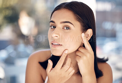 Buy stock photo Beauty, acne and face of woman with skincare hygiene, routine and grooming check with concern. Aesthetic, thinking and facial girl feeling skin texture from pimple cosmetic treatment.

