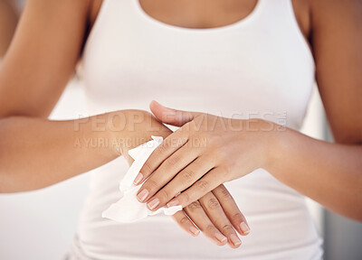 Buy stock photo Woman, hand and sanitizer tissue for cleaning and covid 19 for hygiene, germs or prevent covid, virus or getting sick. Zoom of person hands of antibacterial wipe, cleaning and clean skin for safety
