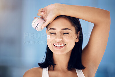 Buy stock photo Skincare, beauty and woman with cream for face, dermatology marketing and container in a home bathroom. Facial wellness, smile and girl advertising a product for clean and healthy skin with a glow