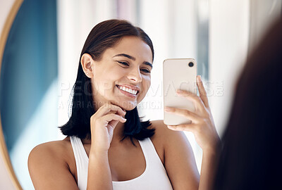 Buy stock photo Mirror selfie, happy woman and phone, beauty and skincare in bathroom of home. Smile young girl taking photograph in reflection, mobile and social media influencer doing morning routine vlog
