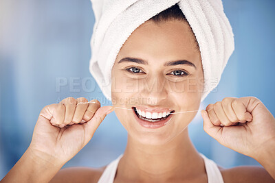 Buy stock photo Face, dental and woman flossing teeth for oral health and hygiene. Portrait, tooth wellness and happy, healthy and young female from Canada with smile cleaning mouth for dental care in the morning

