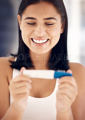 Buy stock photo Pregnancy test, happy and smile with a woman reading the results after testing with a home kit in her bathroom. Wow, pregnant and fertility treatment with a female mother to be feeling excited