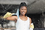 Black woman, portrait smile and washing window for clean hygiene, domestic work or cleanliness at home. Happy African American female spraying soapy detergent on glass windows and wiping surface