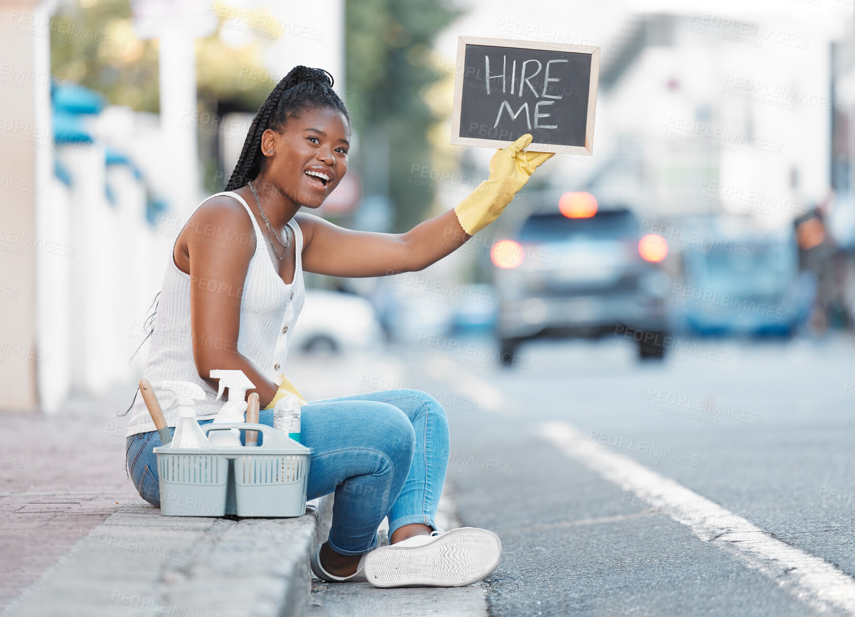 Buy stock photo Woman, street and poster for looking for job or hiring for cleaning service, work or opportunity in city. Black woman, cleaner or domestic freelancer on metro sidewalk with basket, sign or product