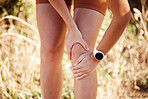 Knee pain, hiking and injury of woman in fitness, anatomy and exercise muscle with hands massage at outdoor adventure. Sports, running and runner girl with legs joint pain or accident in nature park