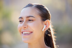 Earphones, woman and fitness with music in nature environment, happy smile or listen to podcast. Athlete portrait, happy runner or sports female with workout, training or exercise outdoor in forest