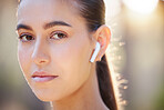 Face portrait, earphones and woman in nature streaming music, radio or podcast. Sports, fitness and female from Canada outdoors listening to audio, song or sound track and getting ready for training.