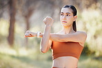 Stretching, fitness and nature woman for exercise, running and outdoor wellness with muscle power, energy and focus in park. Forest, woods and sports runner girl with goal for cardio health training