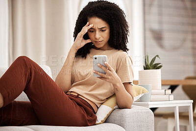 Buy stock photo Stress, headache and phone by woman on a sofa with anxiety, bad news or break up text in her home. Confused, black woman and internet glitch on cellphone while texting, social media and browsing