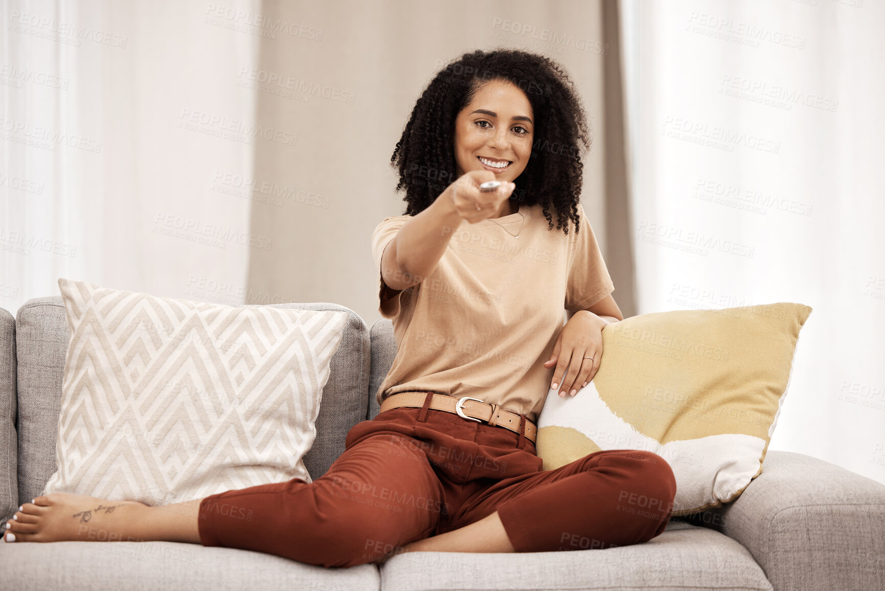 Buy stock photo Tv, portrait and woman relax on sofa, happy and smile while channel surfing in living room at home. Black woman, remote control and watching tv on a couch, excited about weekend freedom in her house