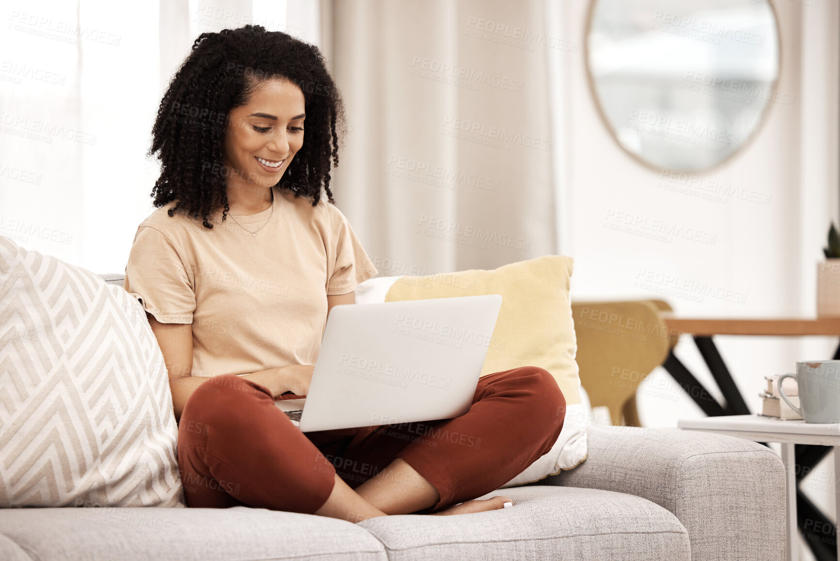 Buy stock photo Black woman, working and laptop typing in a living room home doing happy work research. Remote freelancer working on web planning and digital marketing with a smile on a computer online in a house