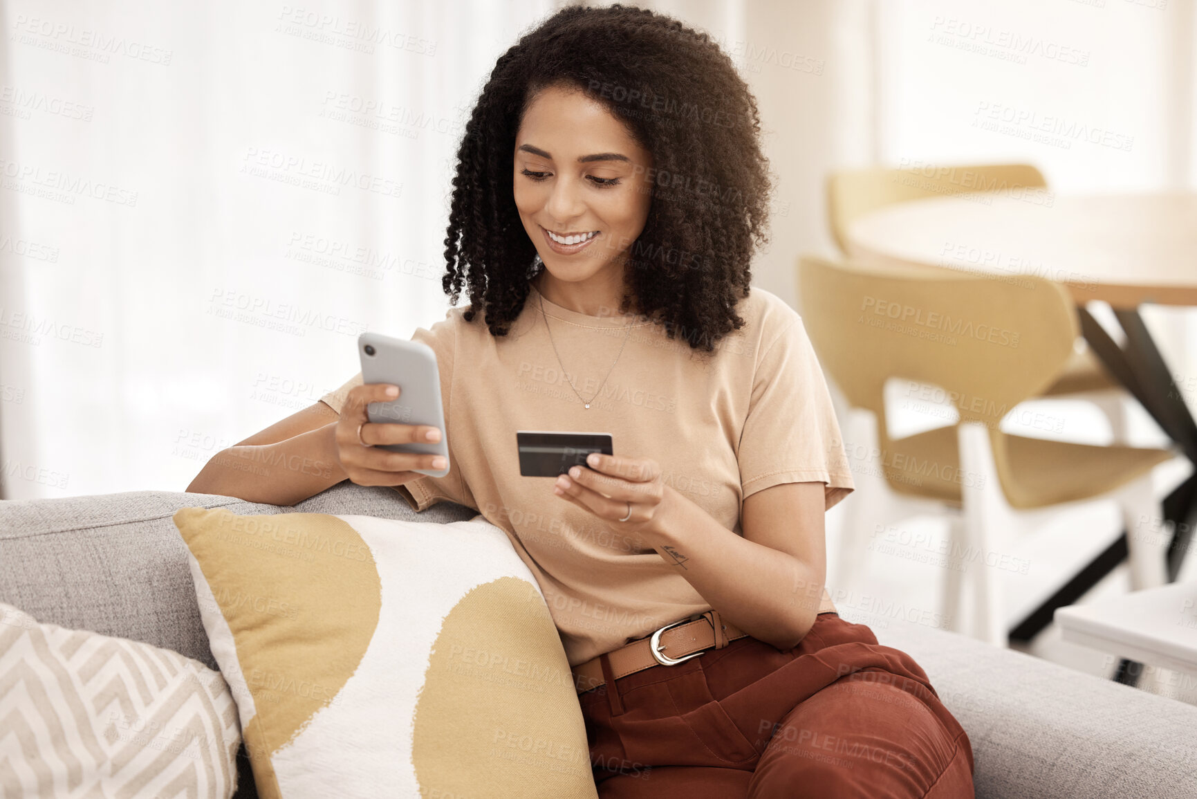 Buy stock photo Black woman, smartphone and credit card on sofa for ecommerce, online banking and paying bills in living room. African American female, young lady or cellphone for connection, payment query and smile