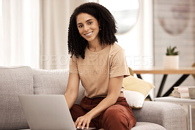 Buy stock photo Laptop, sofa and relax with a black woman browsing the internet while in the living room of her home alone. Portrait, happy and smile with a female sitting on her couch in the house on a weekend
