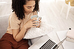 Relax, black woman and tea at laptop streaming app movie, series or tutorial on home couch. Tech, subscription and internet connection of girl on sofa watching online leisure entertainment.


