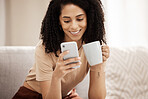 Coffee, phone and woman relax on a sofa, texting, social media and chat in a living room, happy and smile. Tea, black woman and online chatting on a couch, laughing and internet search in her home