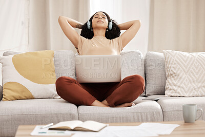 Buy stock photo Black woman, headphones and laptop to relax, on couch for wellness and meditation in living room. Young female, girl and earphones for podcast, rest and on break for health, calm and peaceful on sofa