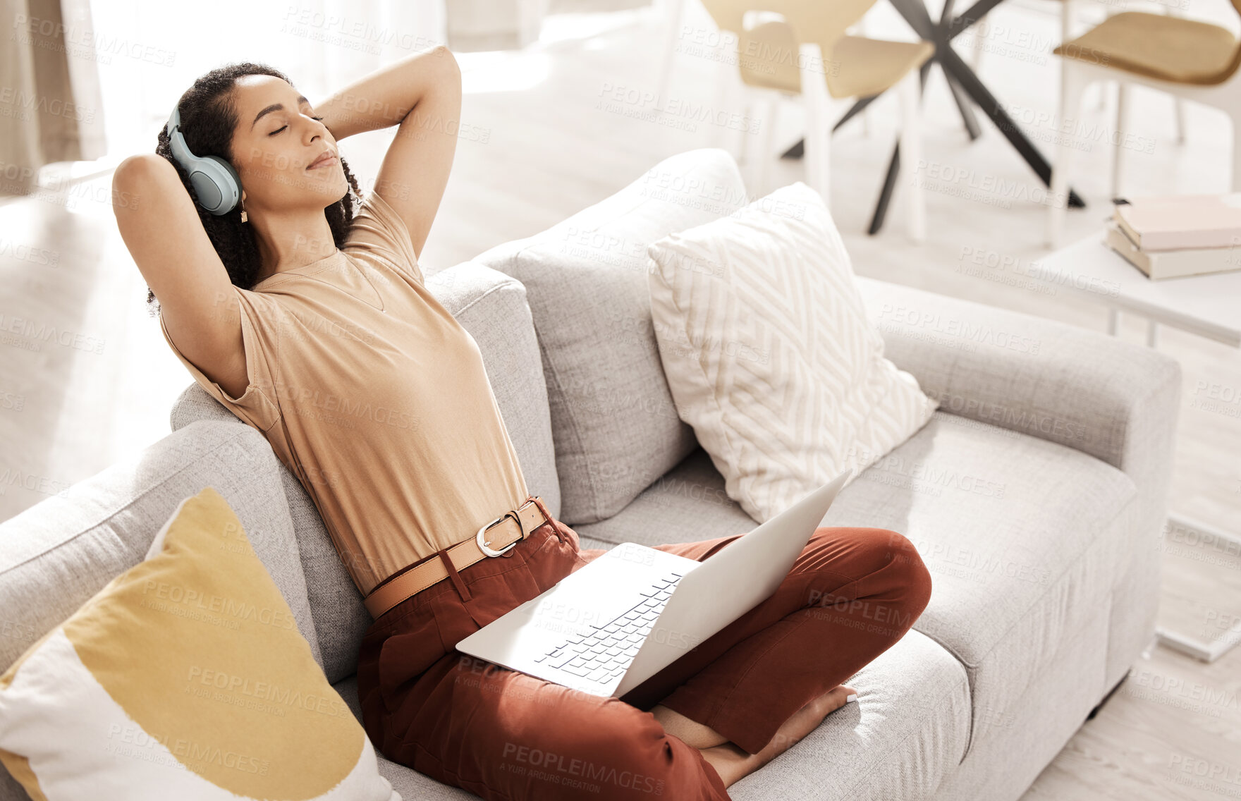 Buy stock photo Woman, relax and remote work with headphones doing marketing research on a living room sofa. Black woman calm listening to music working on internet with technology in peace at home feeling zen