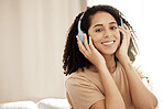 Woman, headphones and relax portrait with music or streaming online podcast. Black woman, happy and audio radio motivation or calm happiness, listening on headset tech or happy on sofa in living room