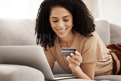 Buy stock photo Laptop, credit card and woman on a sofa for online shopping, e commerce and payment in a living room, happy and smile. Ecommerce, black woman and online subscription upgrade, buying and shopping 