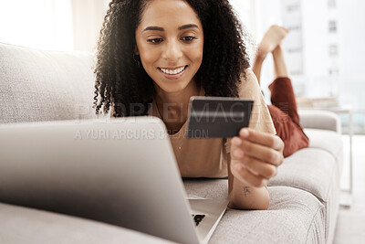Buy stock photo Black woman, credit card and laptop with ecommerce and online shopping, happy and relax on couch in living room. Payment, banking and e commerce payment, connection and technology with retail on web.