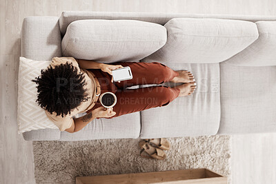 Buy stock photo Top view, relax and black woman with phone on sofa drinking coffee and on social media, internet and online. Communication, technology and girl with mockup screen on smartphone for mobile app at home