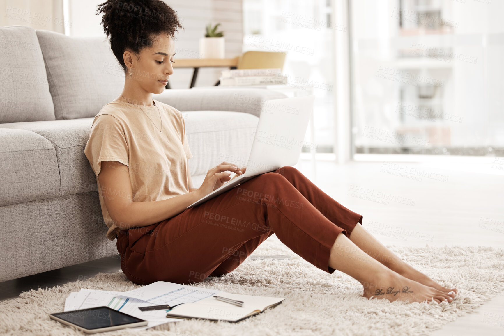 Buy stock photo Freelance woman, laptop and typing email, communication or information for data analytics on carpet in living room with paperwork. Remote work, internet research and study with entrepreneur student