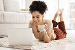 Computer remote work, black woman and living room floor with morning coffee working on an email. African woman happy on wifi, laptop and technology job online with a smile in a living room house 