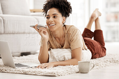 Buy stock photo Phone call, laptop and coffee with a black woman lying on the floor of her home living room alone. Computer, mobile and drink with a female browsing online in her house over the weekend to relax