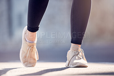 Athlete woman, running and shoes on street for fitness, workout and training outdoor in summer sunshine. Runner girl, sneakers and exercise on city road, ground or metro for health, wellness or sport