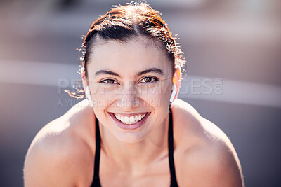 Buy stock photo Portrait, face and fitness with a sports woman listening to music while running outdoor for cardio exercise. Happy, smile and workout with a female runner training alone for an endurance marathon